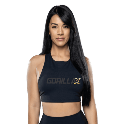 A woman wearing a black sports bra with the logo 'GorillaX' on the front.
