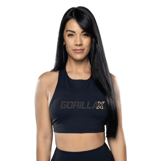 A woman wearing a black sports bra with the logo 'GorillaX' on the front.